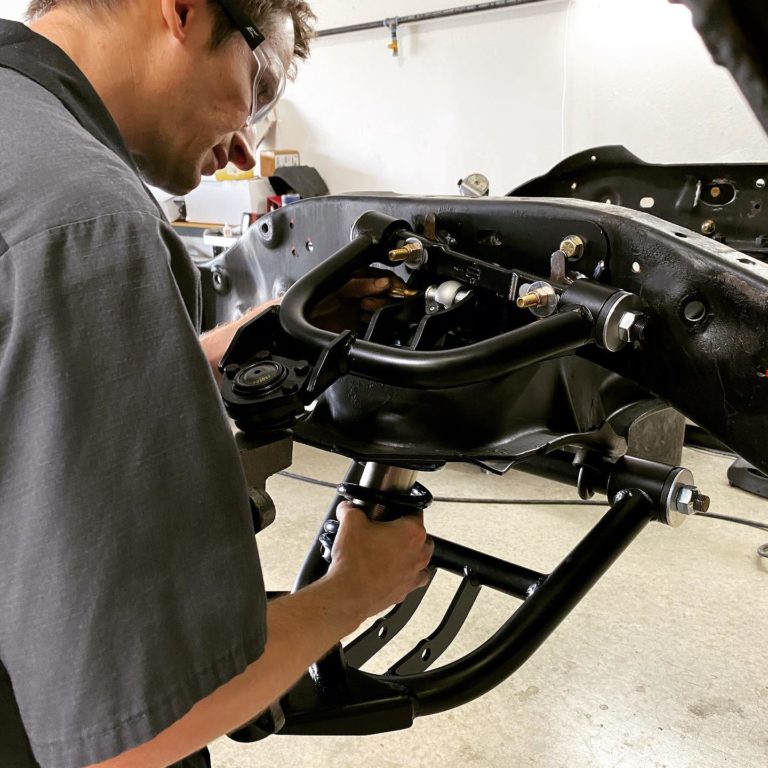 An automotive repair technician checking out the chassis suspension; steering and suspension in Queen Creek, AZ at APA Auto & Fleet Care.