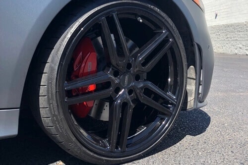 5 Signs It's Time for Brake Service and Repair | Ace Performance Automotive in Queen Creek, AZ. Image of a car on halt, focusing on the tires.