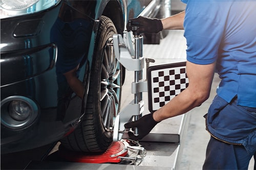 Wheel alignment work at repair service station